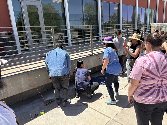 Students and professors trying to figure out the best plan for install of casting project